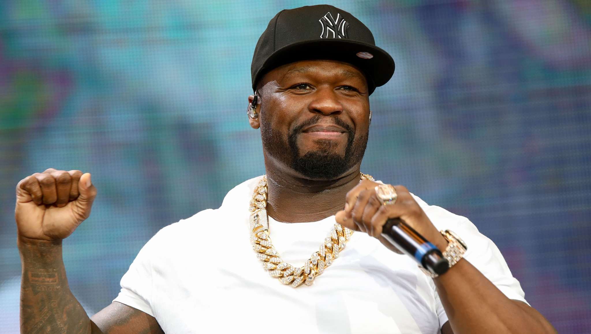 50 CENT JOINS SNOOP DOGG IN THE RAPPER BOXING CRAZE, SERVING AS THE TRILLER COMMENTATOR FOR THE HOLYFIELD VS. BELFORT FIGHT.